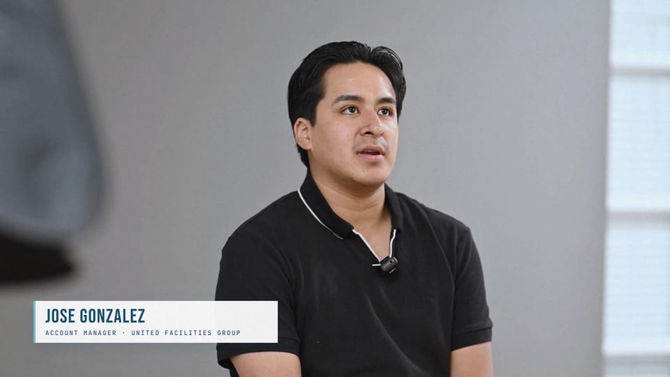 Jose Gonzalez speaking in a black polo, a frame from the film Super Bowl Sunday